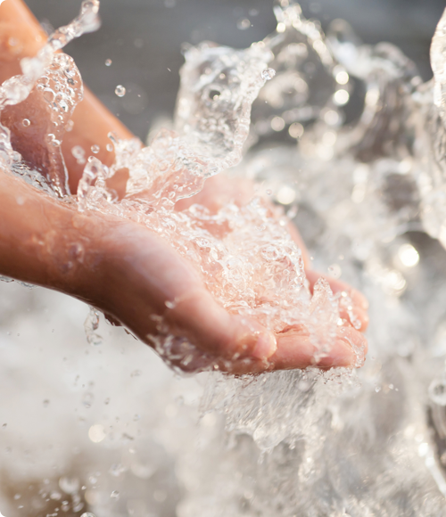 Hands being washed under water