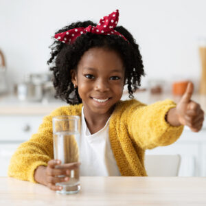 happy child with water in hand